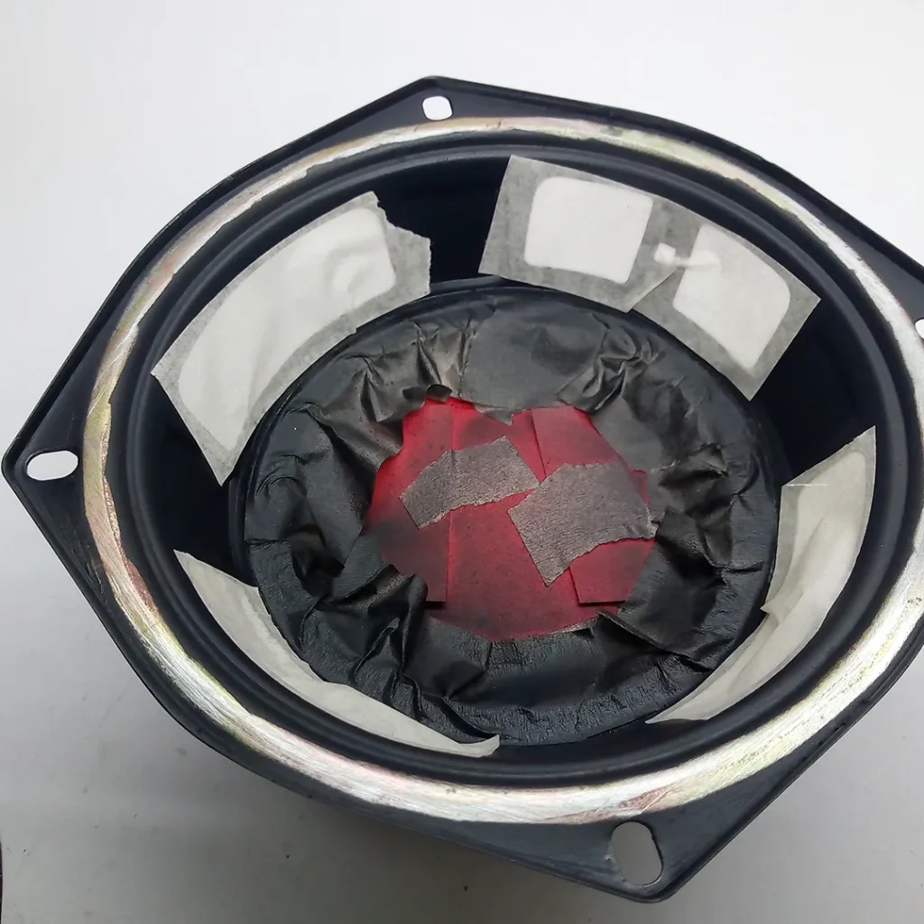 Masking inner surface of the speaker to paint exterior