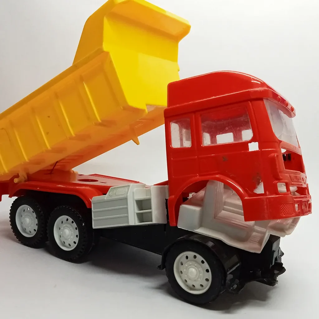 Broken plastic toy used to make abandoned truck