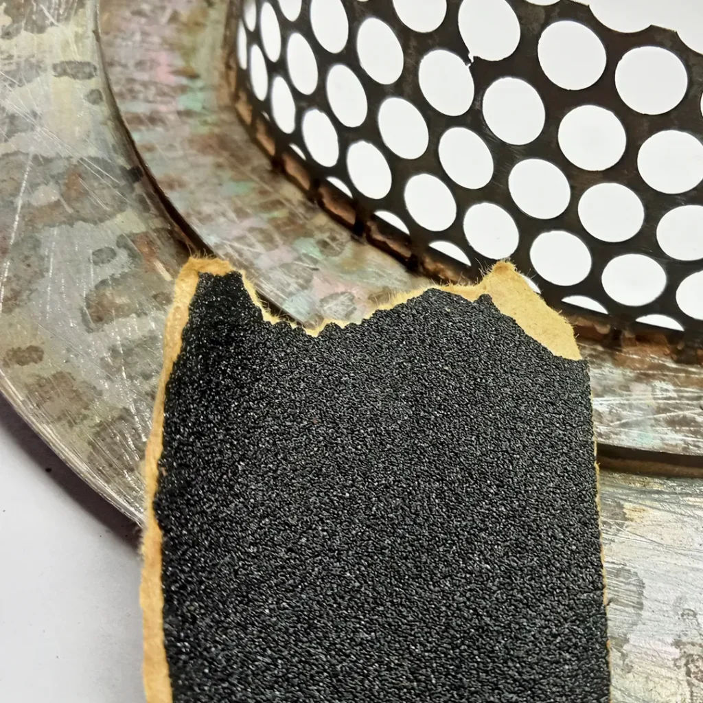 Cleaning the surface of the filter using sand paper
