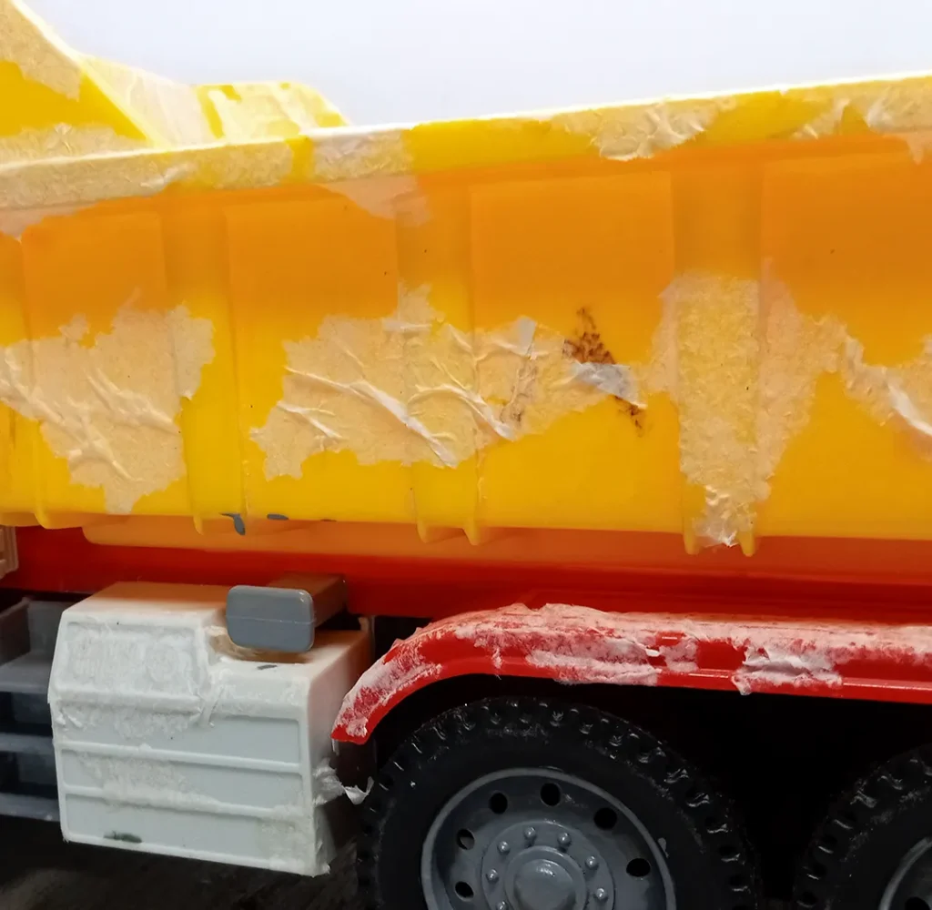 Created a rough texture on the truck body surface using tissue paper on dumper.