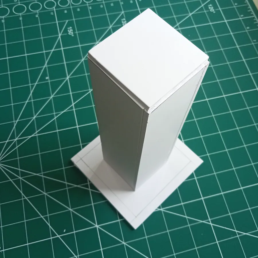For the DIY concrete flower pot, I fixed the inner rectangular tube to the base using glue.